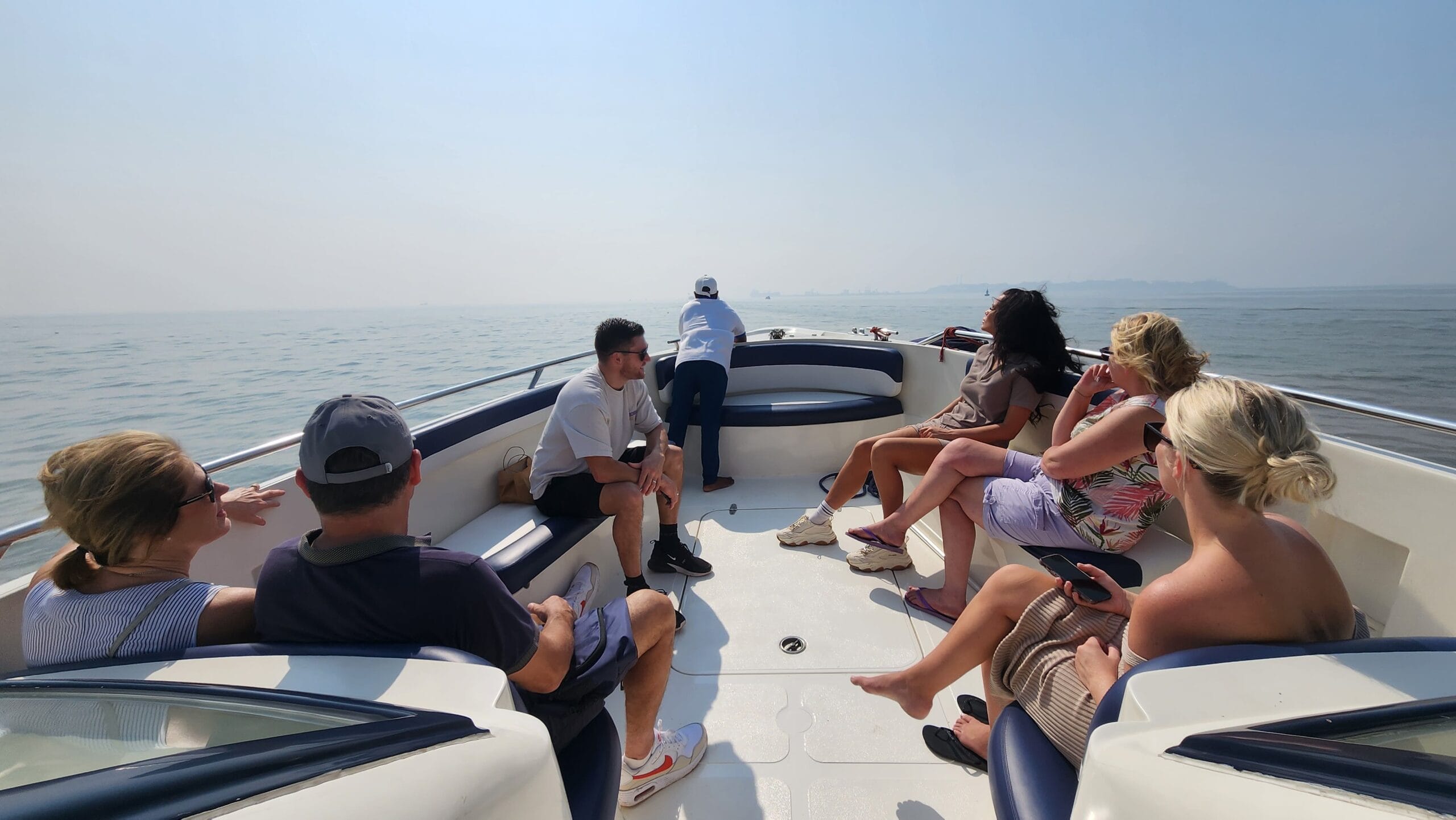 Group of cruise passengers enjoying a private speedboat ride to Elephanta Caves from Mumbai Harbour