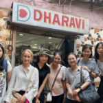 Travel group visiting Dharavi neighborhood during a guided Mumbai cultural tour