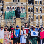 Mumbai Shore Excursions Guide Tour group photo in front of Chhatrapati Shivaji Maharaj Terminus during a guided Mumbai sightseeing tour