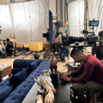 Film crew and cinema cameras set up inside a Mumbai movie studio during a Bollywood shoot