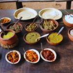 Traditional Goan vegetarian meal served on a rustic table at spice farm
