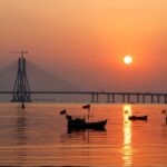 Mumbai harbour sunset with fishing boats and Bandra Worli Sea Link