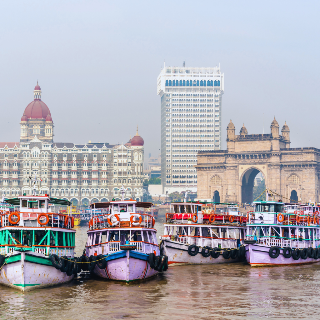 Elephanta Caves ferry boats near Gateway of India Mumbai with Taj Mahal Palace Hotel, commonly used for Elephanta Island ferry transfers from Mumbai harbor.