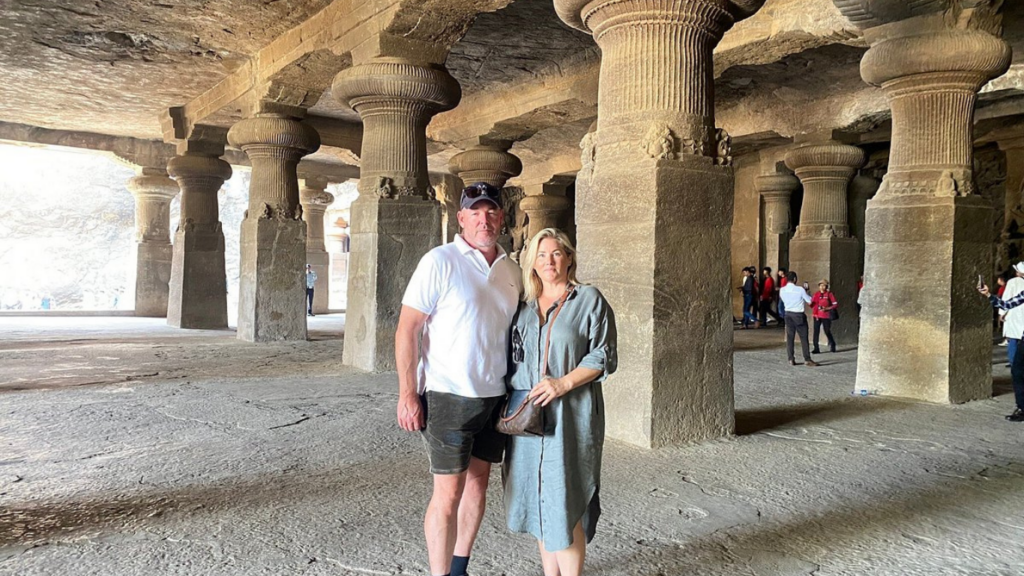 Visitors exploring Elephanta Caves during a luxury Elephanta Caves private speedboat tour from Mumbai